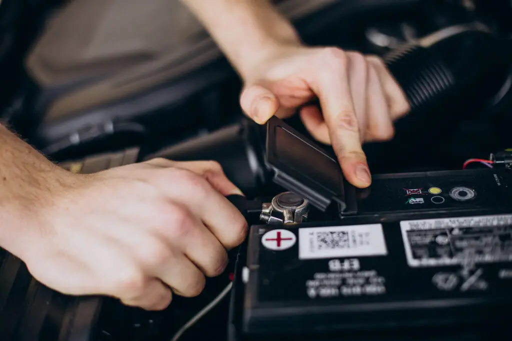 repair man making car service